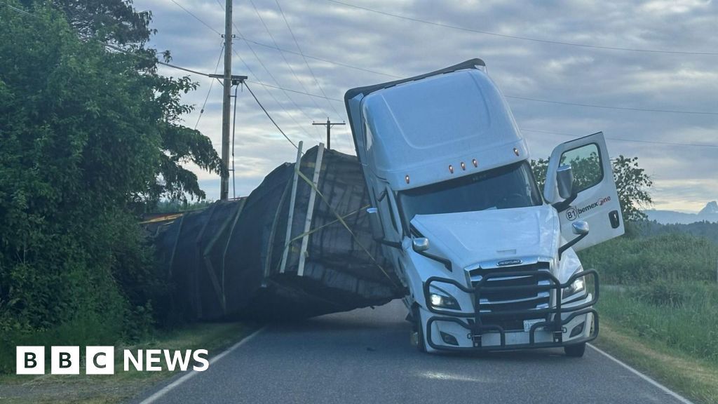 Master bee-keepers are called to the scene after a truck containing 70,000 pounds of active honey bee hives flipped over.