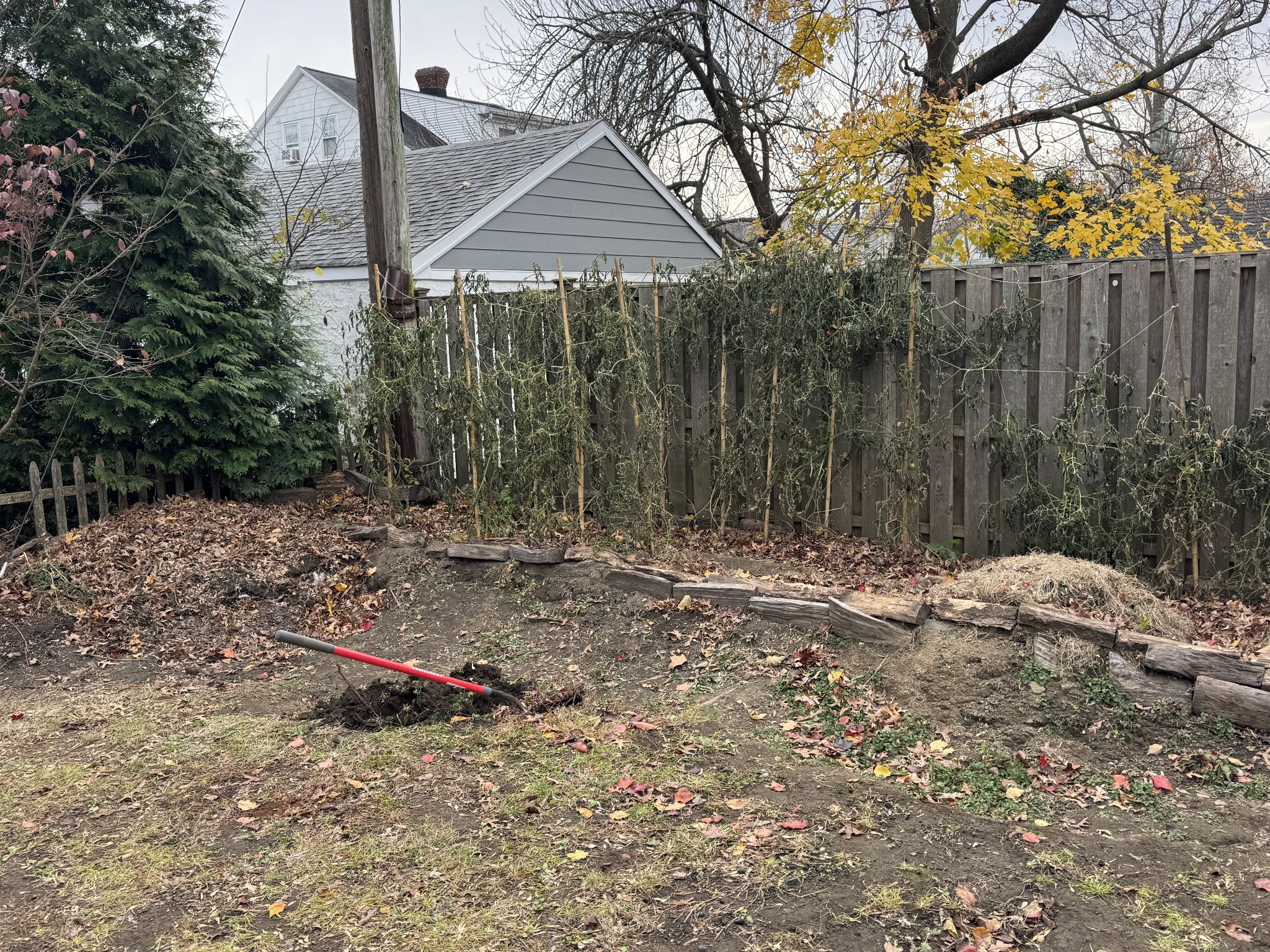I dug a trench in the back in front of the raised garden bed but the yard is sloped to run away from it 