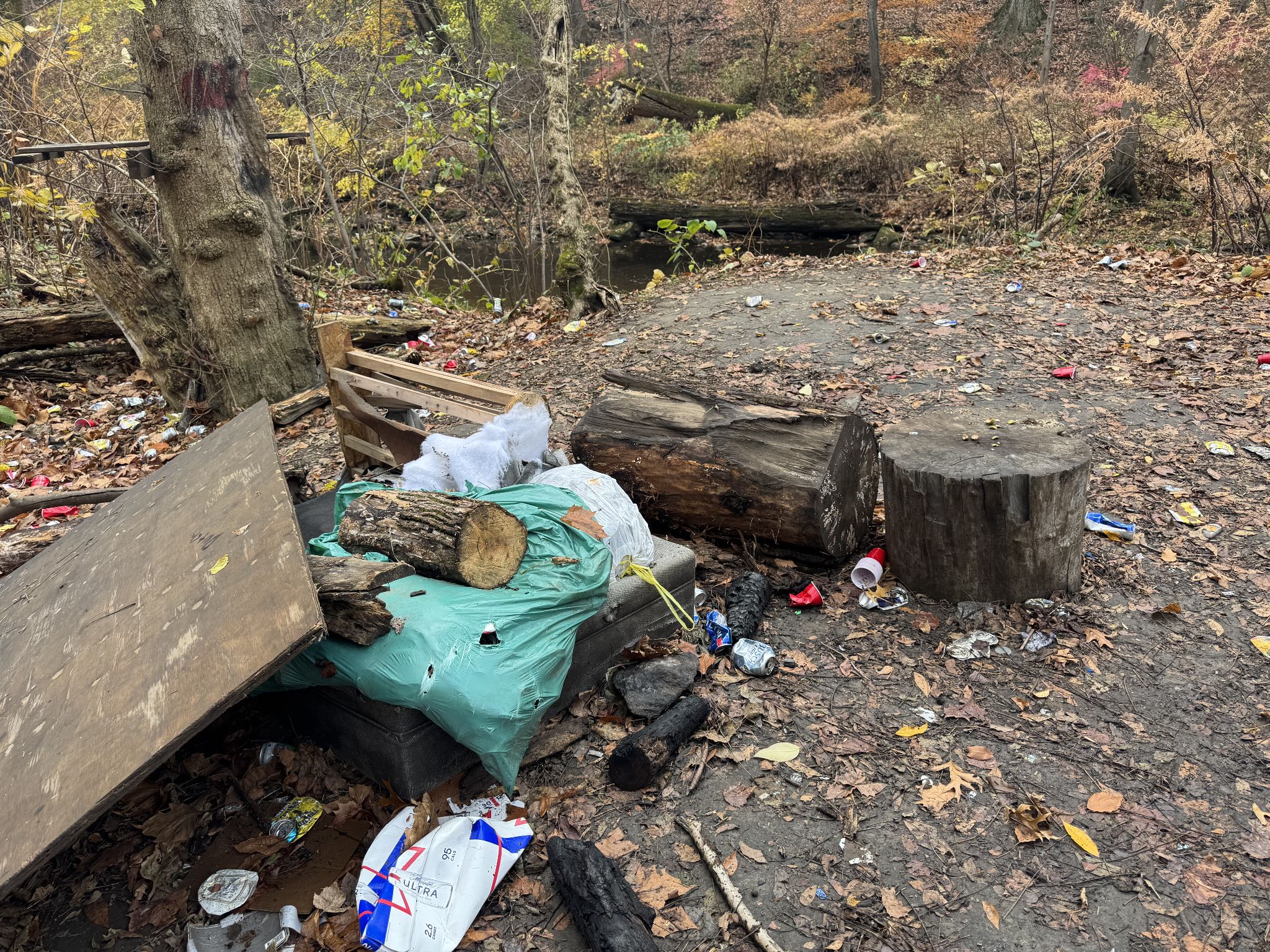 The trash moved, possibly to be used as the foundation for a beer pong table?