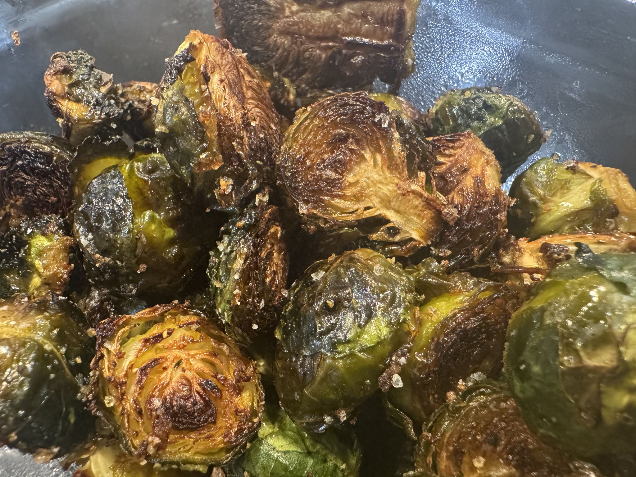 Halved at 400 in olive oil and garlic salt, added a sliced tablespoon of butter midway through and just let them hang until soft