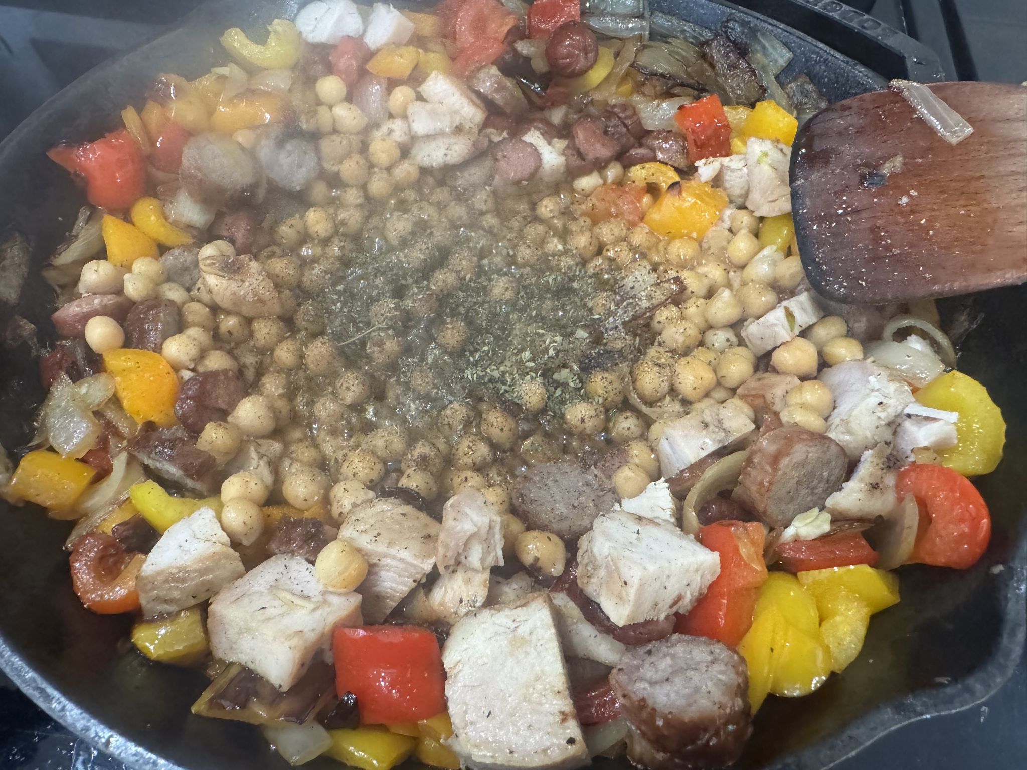 Let the garbanzos cook down for a bit before salt, pepper, oregano, cinnamon